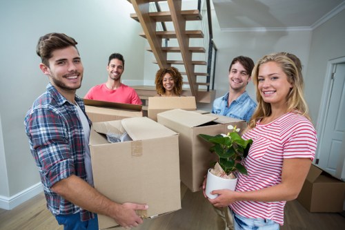 Removals crew loading furniture near a Fulham property
