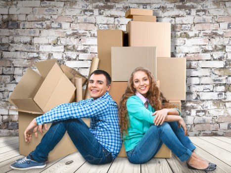 Moving boxes and furniture prepared for a home move in Fulham