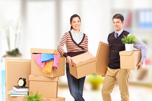 House movers protecting furniture during a move in Fulham