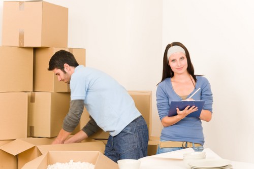 Staff carrying out a structured risk check during a removal job